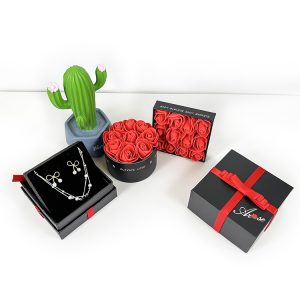 Happy Valentine’s Day gift packaging black paper cardboard box with ribbon ornament outside