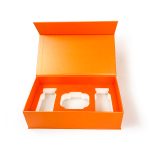 Orange rigid boxes with white EVA insert covered by paper card